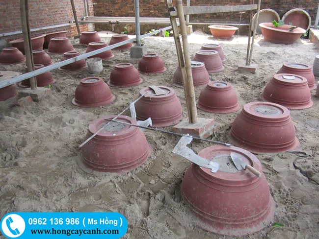 Sản xuất và cung cấp chậu xi măng tròn sơn đỏ chuyên nghiệp tại khu vực Hà Nội